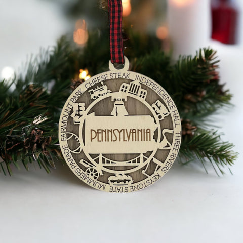 Keystone State charisma for your tree! Introducing the Pennsylvania State Highlights Ornament—a miniature masterpiece celebrating history and hometown pride. Elevate your holiday decor with a touch of Pennsylvania charm.