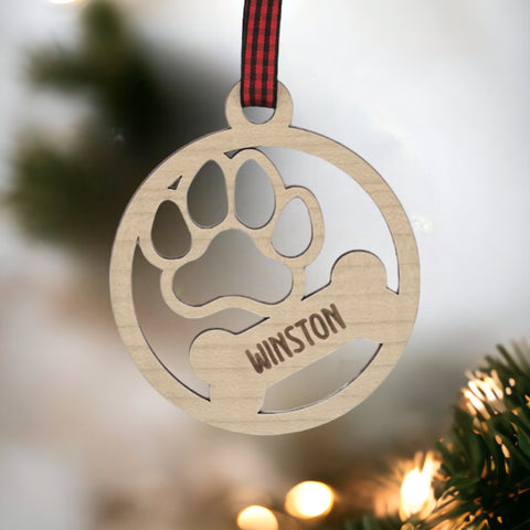 Capture the pawfect moments with our Personalized Dog Paw Bone Ornament. Add a unique touch to your holiday decor by customizing this charming keepsake with your furry friend's name. Celebrate the joy and love your dog brings to your life with this delightful ornament, a heartwarming addition to your festive traditions.