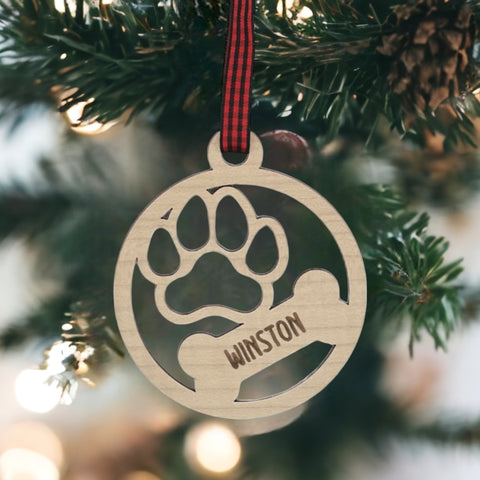 Capture the pawfect moments with our Personalized Dog Paw Bone Ornament. Add a unique touch to your holiday decor by customizing this charming keepsake with your furry friend's name. Celebrate the joy and love your dog brings to your life with this delightful ornament, a heartwarming addition to your festive traditions.