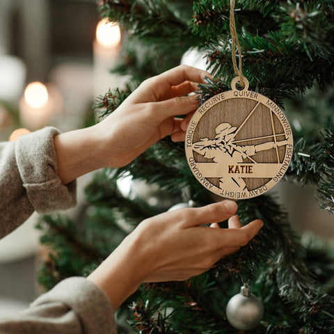 Hit the bullseye of holiday cheer with our Personalized Female Archer Ornament! Crafted for archery enthusiasts, this custom keepsake adds a personal touch to your tree. Celebrate the precision and strength of your archer with this spirited ornament. Customize now for a striking touch in holiday decor – order your Personalized Female Archer Ornament today!