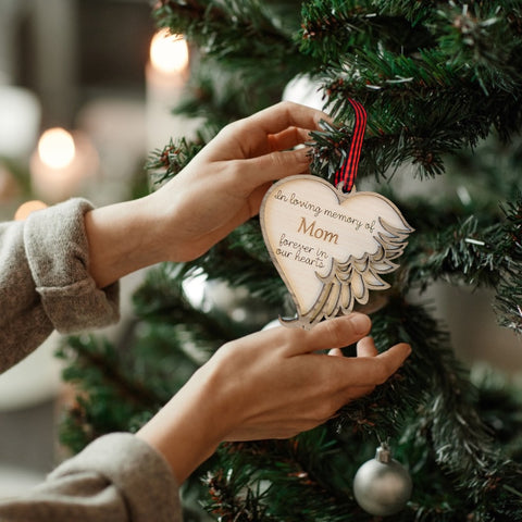 Personalized memorial ornament in loving memory of Mom. Thoughtfully crafted, this special keepsake beautifully honors her enduring love and legacy, offering a heartfelt remembrance during the holiday season.