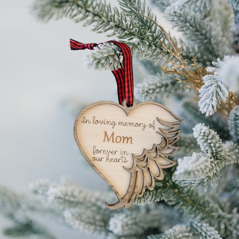 Personalized memorial ornament in loving memory of Mom. Thoughtfully crafted, this special keepsake beautifully honors her enduring love and legacy, offering a heartfelt remembrance during the holiday season.