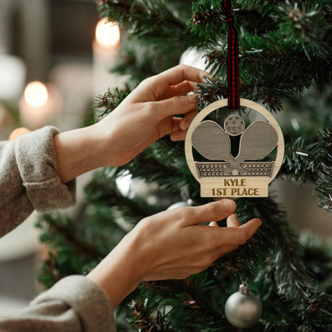 Personalized Pickleball Paddle Ornament, a sporty and unique addition to your holiday decor. Customize with a name or special message, celebrating the joy of pickleball and creating a cherished keepsake for enthusiasts during the festive season.