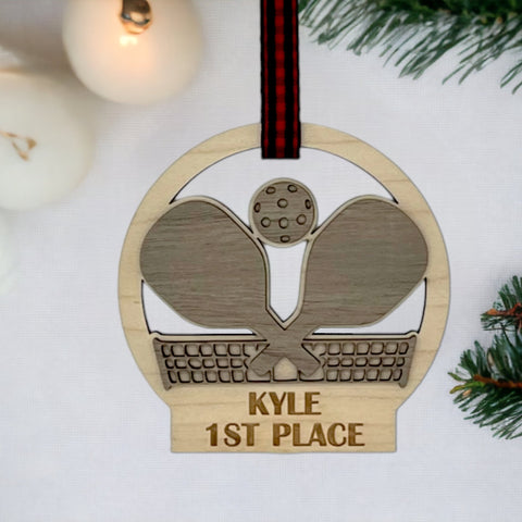 Personalized Pickleball Paddle Ornament, a sporty and unique addition to your holiday decor. Customize with a name or special message, celebrating the joy of pickleball and creating a cherished keepsake for enthusiasts during the festive season.