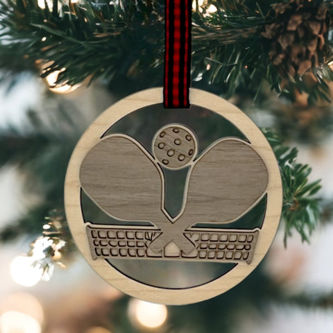 Personalized Pickleball Paddle Ornament, a sporty and unique addition to your holiday decor. Customize with a name or special message, celebrating the joy of pickleball and creating a cherished keepsake for enthusiasts during the festive season.