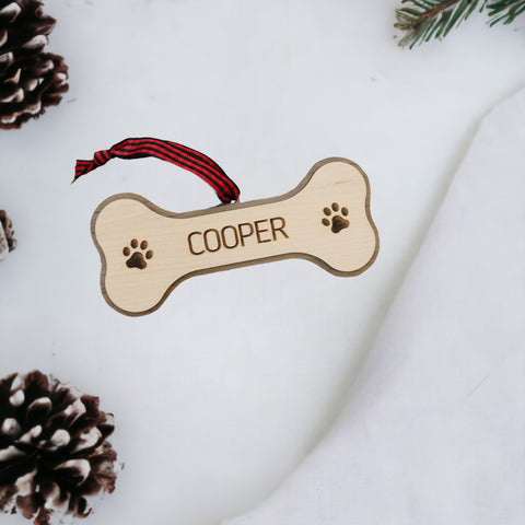 Tail-Wagging Joy: Personalized Dog Bone Ornament - Add a personal touch to your holiday decor with this charming ornament. Customize with your dog's name for a delightful keepsake, celebrating the furry love that fills your home.