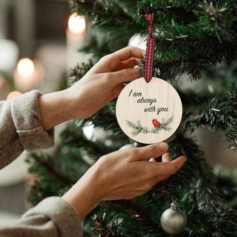 Beautiful red cardinal memorial ornament, symbolizing a loved one's presence. A poignant tribute adorned with a red bird, capturing the spirit and memory of a cherished individual, bringing comfort and warmth during the holiday season.