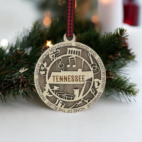 Celebrate the Volunteer State with our Tennessee State Highlights Ornament! A miniature masterpiece capturing the heart and soul of Tennessee's charm. Elevate your holiday decor with a touch of southern warmth. 