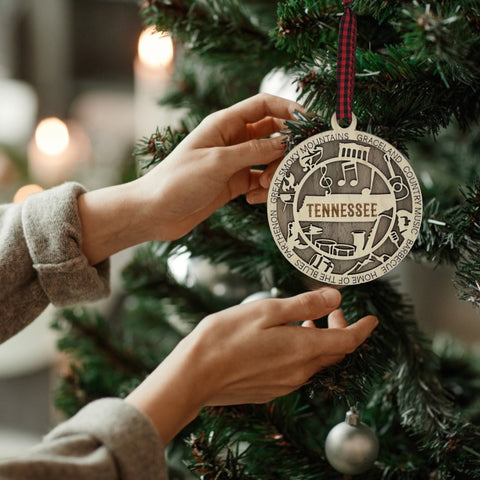 Celebrate the Volunteer State with our Tennessee State Highlights Ornament! A miniature masterpiece capturing the heart and soul of Tennessee's charm. Elevate your holiday decor with a touch of southern warmth. 