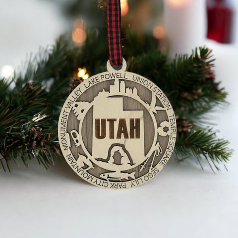 Elevate your holiday decor with the Utah State Highlights Ornament! A stunning tribute to the Beehive State's natural wonders and vibrant spirit. Bring home a piece of Utah's beauty this festive season.