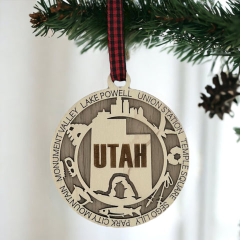 Elevate your holiday decor with the Utah State Highlights Ornament! A stunning tribute to the Beehive State's natural wonders and vibrant spirit. Bring home a piece of Utah's beauty this festive season.