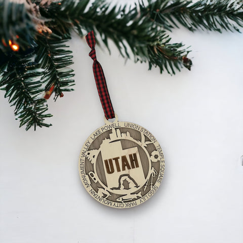 Elevate your holiday decor with the Utah State Highlights Ornament! A stunning tribute to the Beehive State's natural wonders and vibrant spirit. Bring home a piece of Utah's beauty this festive season.