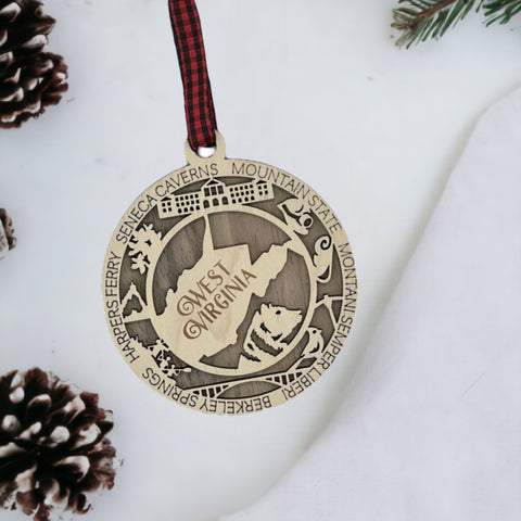 Experience the mountain magic! Introducing the West Virginia State Highlights Ornament—a captivating blend of heritage and scenery. Elevate your holiday décor with a touch of Wild, Wonderful West Virginia. Discover the spirit of the Mountain State this season!